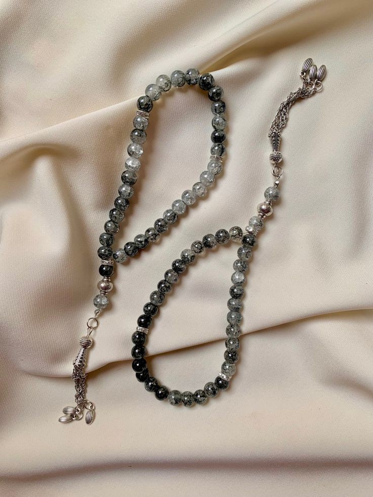 Made with natural amber stones, strung on golden silk cord. Soft musk fragrance for a calming effect.  Care: Avoid chemicals and direct sunlight. Store in the original box.
